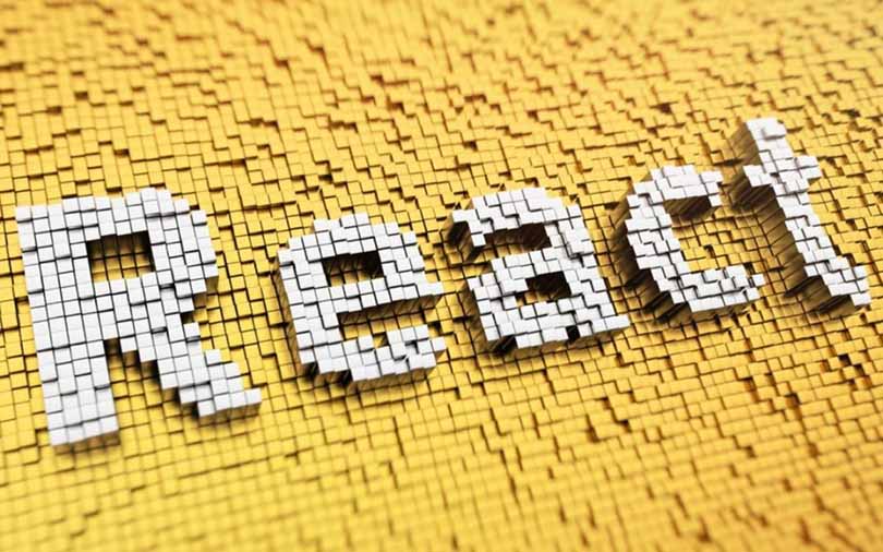 Image of the word “React” written in white on a yellow background