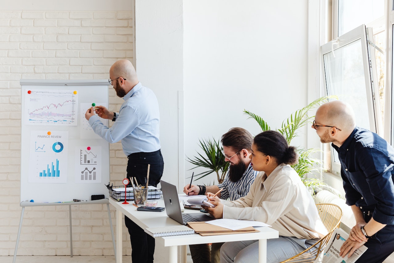 Four professionals reviewing data to make more informed decisions