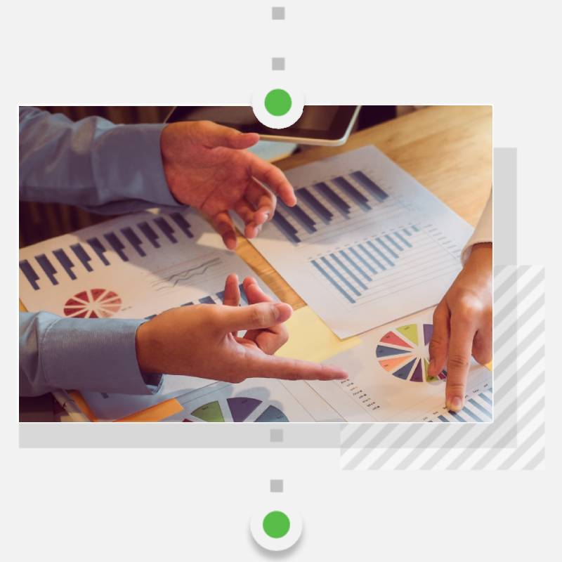Hands of male professional and female professional reviewing digital product KPIs