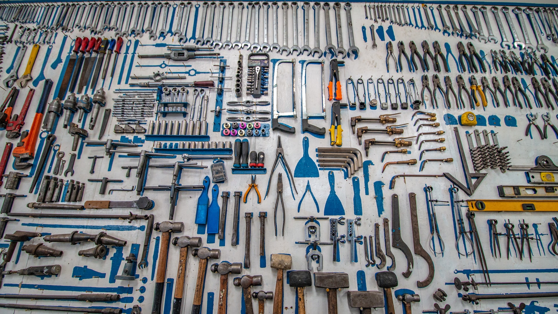 Collection of brightly-colored house tools