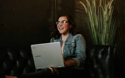 Young professional reviewing modernized application on her laptop