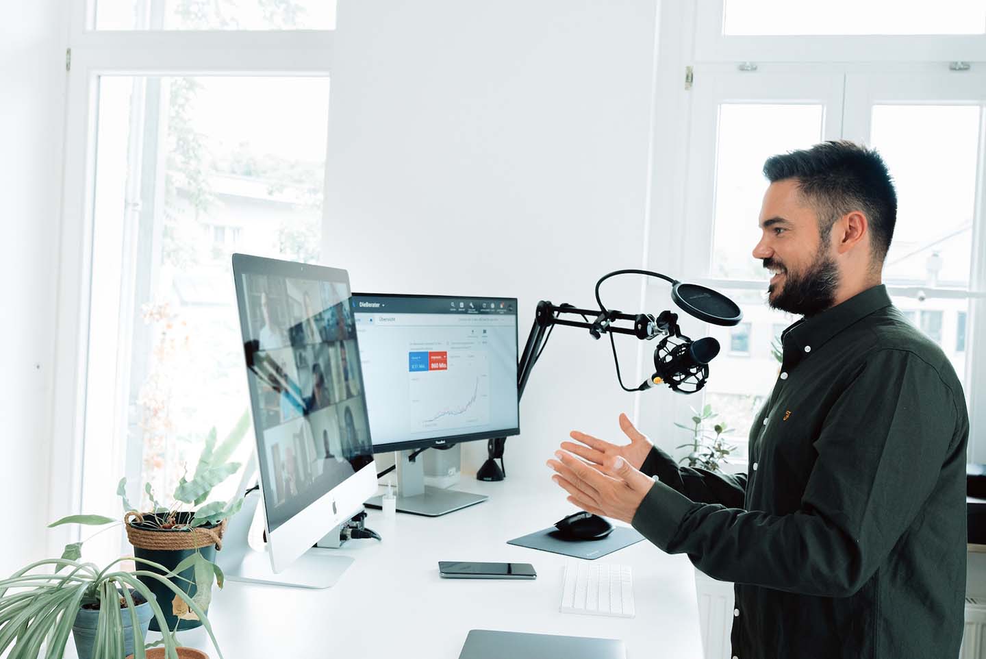 Young professional on a video call with his coworkers