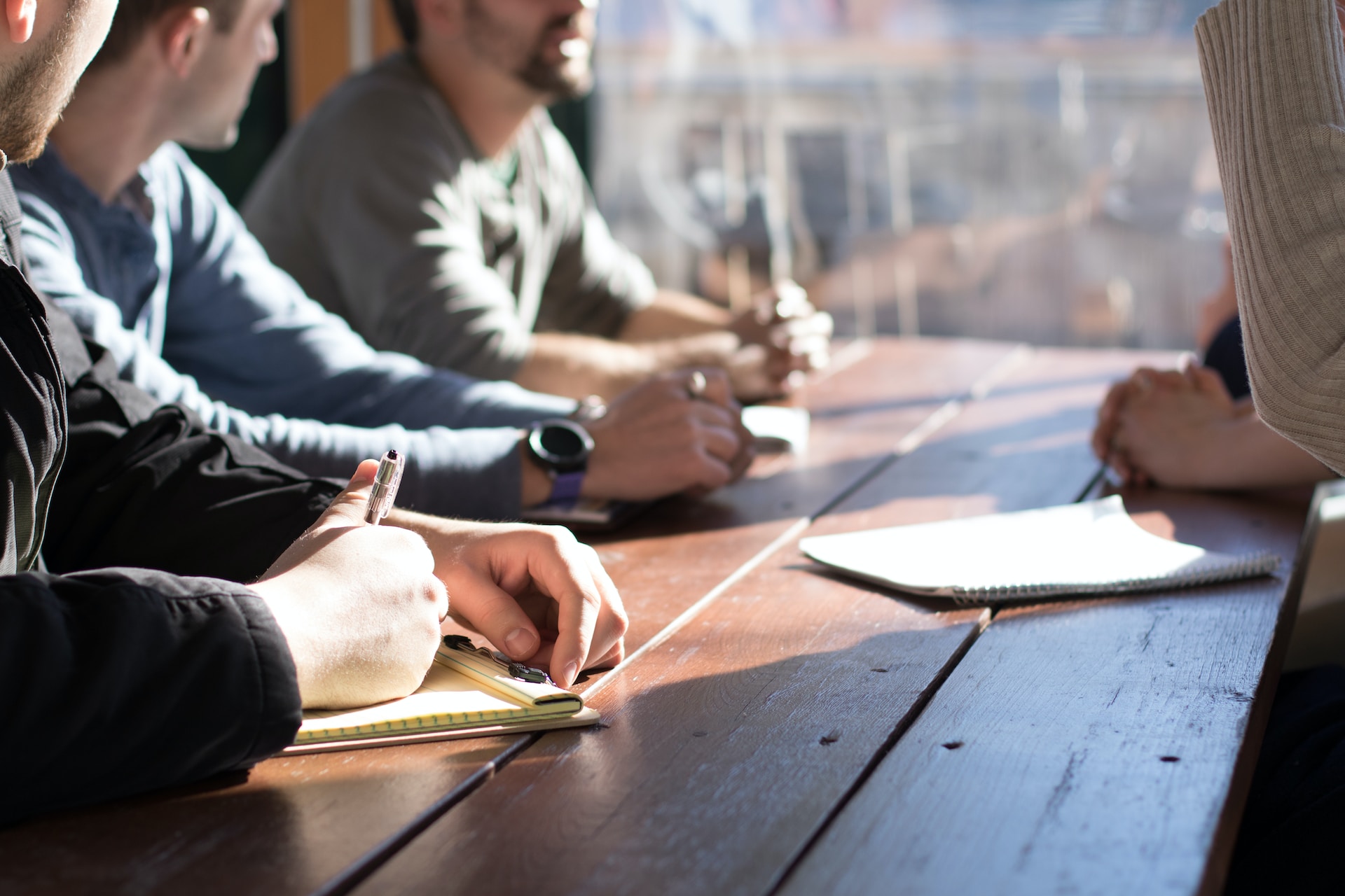 Agile digital product development team brainstorming at a table