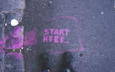 The words “Start Here” written in chalk on a sidewalk, symbolic of getting started using generative AI